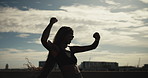 Fist pump, time and wind with woman runner outdoor on bridge for achievement or milestone. Celebration, exercise and watch with happy athlete cheering for fitness, running success or training