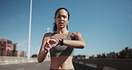 Smart watch, fitness and woman on highway for distance, wellness or running check in city. Health, sports tech and female athlete on bridge for cardio workout, exercise or training with challenge.