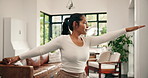 Balance, yoga and woman in home for warrior pose, wellness and mobility exercise in morning. House, floor and person with practice, hobby and fitness routine for posture, flexibility and health
