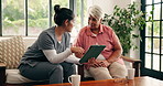 Discussion, tablet and old woman with caregiver on couch, health assessment survey and medical checkup. Elderly care, wellness evaluation and happy senior person with nurse in home, talking and tech