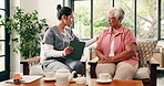 Old woman, nurse and comfort with clipboard in home for healthcare report, explain or diagnosis on couch. People, caregiver and senior patient on sofa for paperwork, consulting and sad in retirement