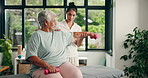 Senior woman, physiotherapist and dumbbells with support for injury recovery at wellness clinic. People, exercise and weightlifting for rehabilitation, guide or help for elderly patient in retirement