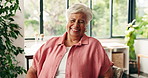 Wellness, face and old woman in living room with smile, positive attitude or chill in retirement. Laugh, portrait or elderly person in house with good mood, happiness and peace on weekend break.