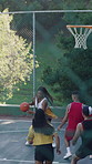 Woman, friends and dribbling on basketball court with game, skill or fitness for social gathering in city. People, group and team with sports, challenge or contest with exercise at urban park in town