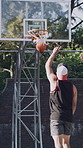 Sports, basketball and teenager shooting for score, competition or training from back outdoor. Player, boy and throw ball at court for fitness, win and fist pump with goal celebration for happiness