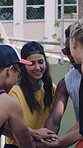 Sport, friends and happy with hands together on court for match win, healthy competition or practice. Basketball community, people or huddle on urban park for friendly game, sportsmanship or applause