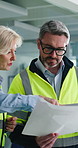 Supply chain, documents and people in warehouse, conversation and storage quality control. Logistics, man and woman in factory, discussion and paperwork for shipping schedule, export and distribution