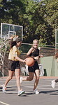 Basketball, bouncing and game with people outdoor together for competition or tournament. Challenge, fitness and sports with group of active players on court for exercise or practice match at venue