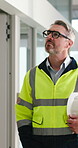 Walk, construction and man with building inspection to monitor safety, renovation project or protocol. Site inspector, mature person and helmet for risk assessment and commercial development quality
