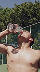 Thirsty, athlete and man with water outdoor for fitness, hydration and exercise recovery. Shirtless, male person and pouring liquid on face for heat, sweat control and cool down from sports challenge