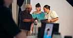 People, photographer and camera with clipboard in studio, review pictures and photoshoot results. Team, talking and equipment for photography checklist, feedback and pose guidance of fashion magazine