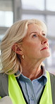 Construction, woman or walk with helmet in office for building inspection, renovation project or protocol. Site, safety manager or check progress for risk assessment or commercial development quality