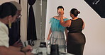 Model, beauty and makeup artist with brush, backstage and photoshoot preparation or makeover process. Behind the scenes, people and foundation application with tools, creative and production setup