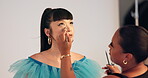 Model, makeover and women with makeup, backstage and photoshoot preparation, talk or beauty process. Behind the scenes, people and foundation application with tools, creative and production setup