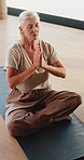Old woman, namaste and meditation with yoga at studio, breathing exercise or eyes closed at gym. Elderly person, lotus mudra and holistic fitness with mindfulness, prayer hands or retirement at club