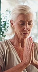 Old woman, prayer hands and meditation at yoga for wellness, breathing exercise or eyes closed at gym. Elderly person, mudra and holistic fitness with mindfulness, namaste or retirement at club