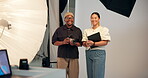 Camera, face, or production with director and photographer in studio for collaboration or shoot. Art, creative or photography with man and woman on set together for bts teamwork or catalog session