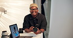 Face, man and photographer in studio with camera, laptop and entrepreneurship for creative career. Happy, black person and cameraman in workplace with photography equipment, computer and photoshoot.