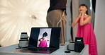 Laptop screen, photographer and model with production in studio for fashion or behind the scenes. People, photoshoot or computer display with backstage photography for digital media or magazine