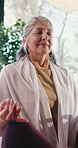 Breathing, meditation and relax with old woman in yoga studio for mental health or mindfulness. Awareness, inner peace and wellness with senior yogi person in class for holistic routine or zen