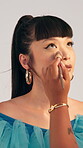Studio, woman and model with makeup artist, hands and photoshoot preparation with cosmetics or brush. Behind the scenes, people and foundation application with tools, creative and beauty process