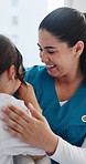 Nurse, smile and hug child for healthcare, support and care with teddy bear in hospital. Medical worker, girl and embrace kid for comfort, wellness and patient recovery with pediatrician in clinic