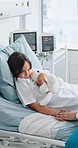 Pediatrician, sick and girl in hospital bed for comfort, healthcare and support with teddy bear. Medical service, patient and kid in clinic, wellness or kindness with healing and rehabilitation care