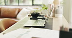 Headphones, mobile or computer setup in home office, research or planning document for remote work. Creative workspace, phone or laptop with audio tech for freelance efficiency, internet or paperwork
