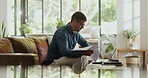 Laptop, freelancer and documents with man on sofa for blog writer, virtual editor or newsletter promotion. Online magazine article, remote worker or email marketing with person in living room of home