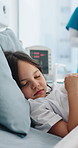 Girl, patient and sleeping with bed in hospital for medical treatment, sedation or medication. Asleep, child or kid relaxing with blanket, rest or dreaming for nap, healthcare or monitoring in clinic