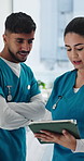 Talking, doctors and people in hospital, tablet for healthcare tips and feedback for surgery schedule. Physician, man and woman in clinic, tech and digital app for medicine inventory and conversation