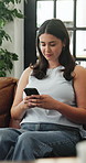 Home, relax and woman on sofa, smartphone for texting and digital app for social media. Apartment, mobile user and person on couch, happiness or cellphone for connection, email or website information