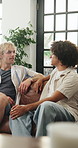 Talking, friends and men on sofa in home for conversation, chat and hangout in living room. Apartment, weekend and happy people on couch for communication, discussion and bonding for social visit