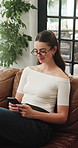 Home, typing and happy woman on sofa, smartphone for texting and digital app for communication. Relax, subscription and person on couch, happiness or cellphone for connection or message to contact