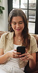 Mobile, relax and smile with woman in home, typing message and reading news on internet. Smartphone, texting and happy person in living room, online connection and notification for social media