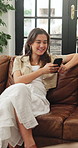 Funny, relax and woman on sofa, smartphone for texting and digital app for social media. Home, online humor or happy person on couch, typing or cellphone for connection and message to contact or joke