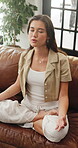 Breathing, calm or woman on sofa in house, mindfulness routine or body awareness practice to relax. Positive affirmation, mediation or person with lotus pose for mental health, peace or stress relief
