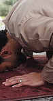 Home, prayer and bow with muslim man for faith, worship and praise Allah for gratitude. Islam, spiritual and person prostrate for praying, dua and salah for holy religion with peace on Ramadan Kareem