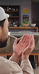 Islam, man or praying with dua for worship, faith or spiritual connection with allah in home. Muslim, male person or blessing with islamic belief, holy religion or praise god for forgiveness in house