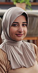 Face, smile and muslim woman in home for relax, peace and calm with faith on Ramadan Kareem. Portrait, hijab and Arab person with culture, islamic tradition and religion in living room in Oman