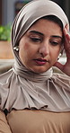 Remote work, headache and Muslim woman on sofa with stress for thinking, mistake and error on project. Freelancer, home and Islamic person with pressure for deadline, crisis and burnout or fatigue