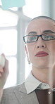 Business, woman and writing on glass in office for planning, strategy and agenda update. Female person, reading and brainstorming with arrow for action steps, problem solving and reminder of deadline