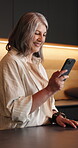 Reading, smile and woman in house with phone, internet search and communication on online platform. Happy, text and mature person in home with tech, social media update and message on digital app.