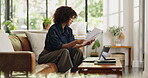 Documents, finance and reading with woman on sofa in living room for budget or investment analysis. Information, paperwork and review with person in apartment for financial report or solution