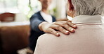 Caregiver, shoulder touch and hands in lounge with comfort, help or empathy in retirement care. Compassion, security or elderly person in house with understanding, support or trust in assisted living