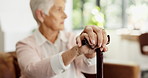 Senior woman, hands and walking stick on sofa with assisted living or nursing home experience. Mature, female person with a disability and cane on couch with thinking for recovery in retirement