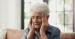 Senior woman, massage and headache at house with stress, hypertension and emotional distress. Elderly person, migraine or brain fog with dizziness, high blood pressure and medical emergency in lounge