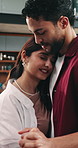 Love, happy and couple in home with dancing to music for bonding, care or connection together. Smile, hug and man with woman for groove to radio for romantic date in living room at apartment.