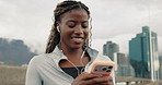 Fitness, woman and earphones in city with phone, social media notification and listening to music. Happy, black person and scroll in urban town with audio tech, mobile app or radio for exercise rest.