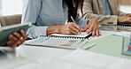 Woman, documents and business people with notebook in meeting for financial report, portfolio and planning. Corporate, team and person writing for investment strategy, statistics and finance agenda
